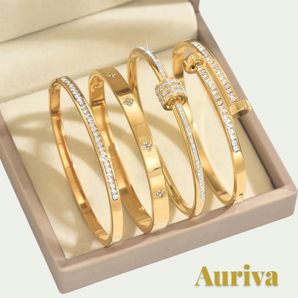 Gr8est Auriva gold titanium steel stacked bangles featuring pave-set cubic zirconia and elegant flower patterns.