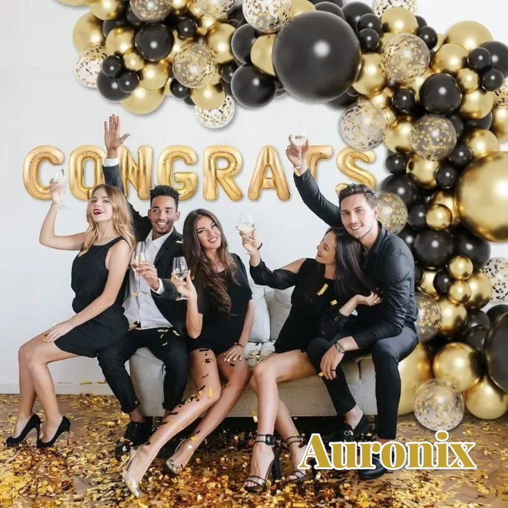 Gr8est Auronix gold and black balloon arch with confetti balloons and CONGRATS foil letters at a party celebration
