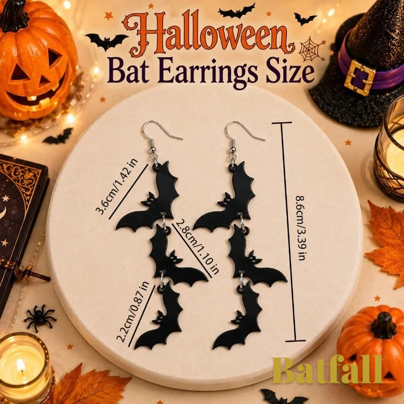 Gr8est Batfall Halloween drop earrings featuring three black bat silhouettes on a display stand with festive decor.
