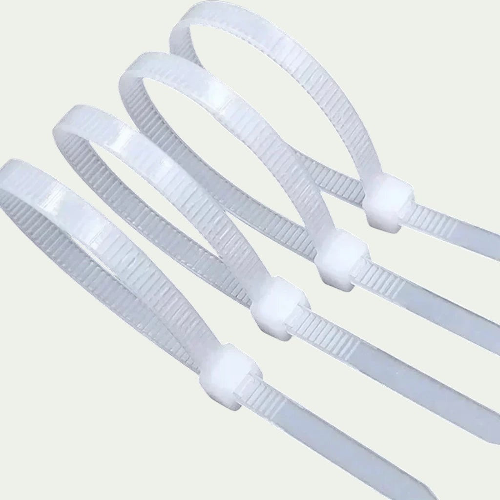 Gr8est BindPro white self-locking nylon cable ties for organizing wires and cables in home or industrial settings.