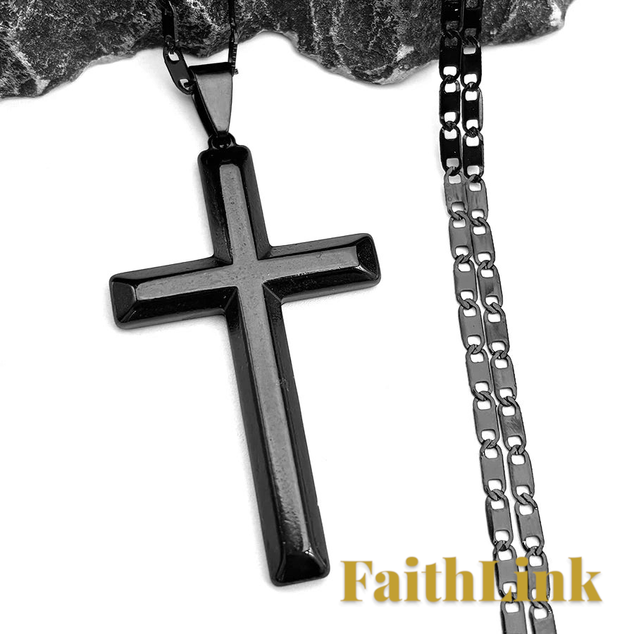 Gr8est black stainless steel cross pendant necklace with a matching link chain on a textured stone background