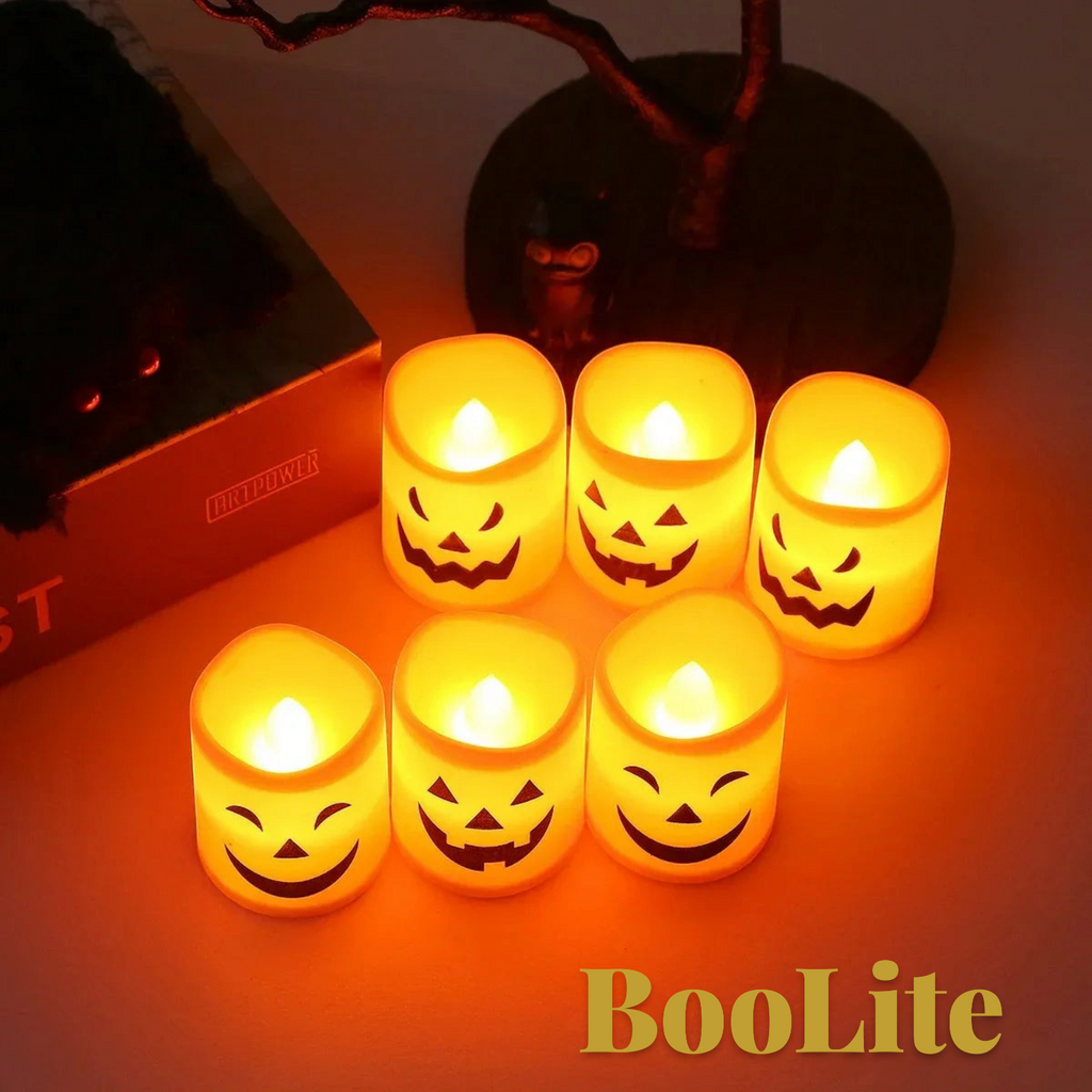 Gr8est BooLite set of six orange-yellow plastic LED flameless Halloween candles with spooky jack-o-lantern faces