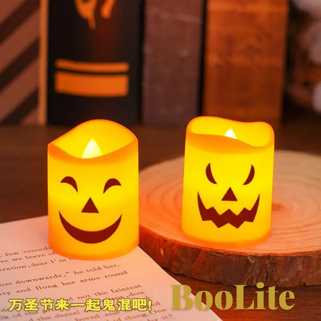 Gr8est BooLite orange LED flameless Halloween candles with spooky pumpkin and ghost faces on a wooden display base