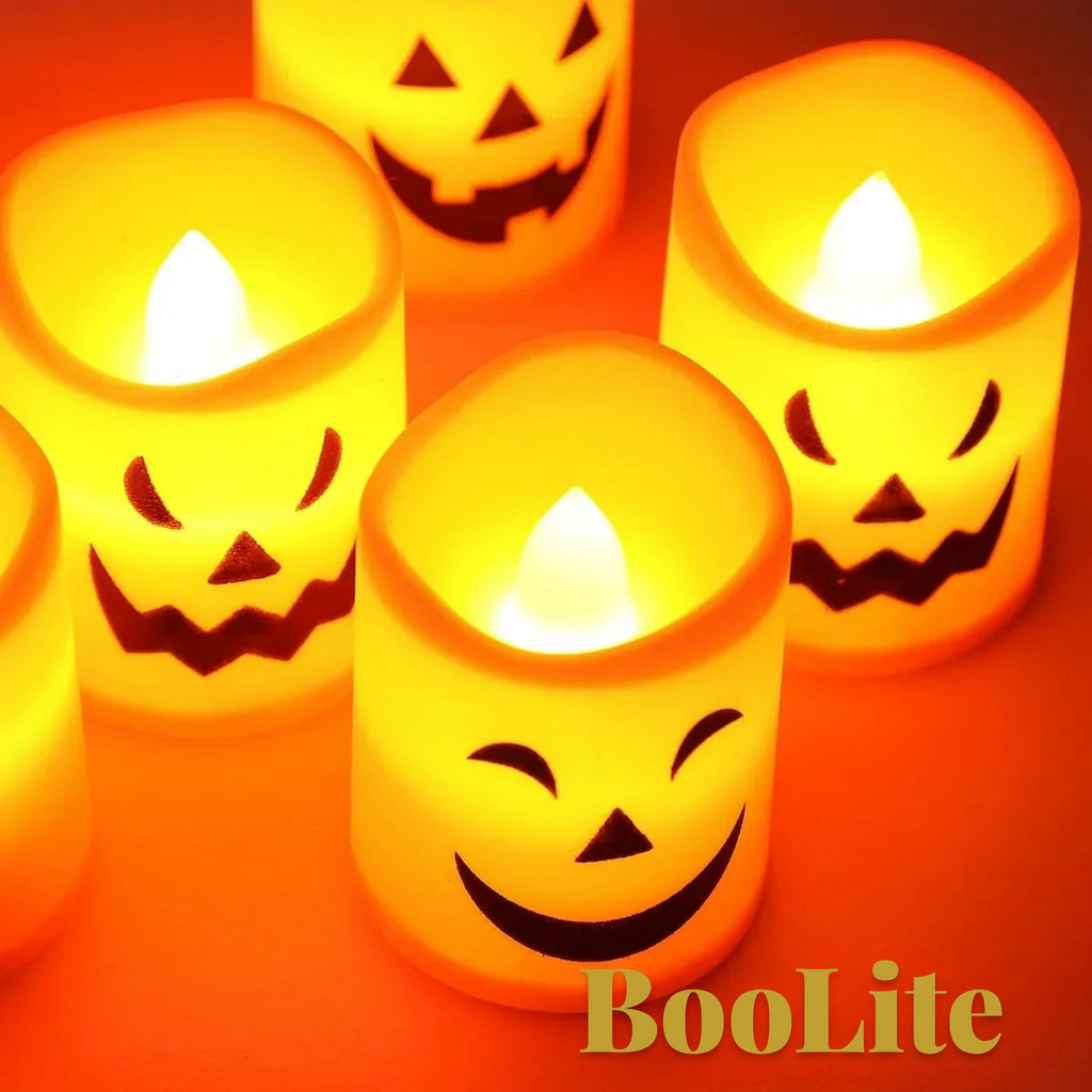 Gr8est BooLite set of six orange LED flameless Halloween candles with spooky jack-o-lantern faces and warm glow