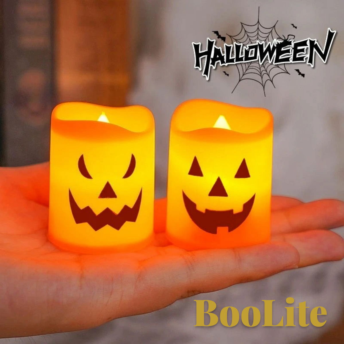 Gr8est BooLite orange plastic LED tea light candles with spooky jack-o-lantern faces held in a hand