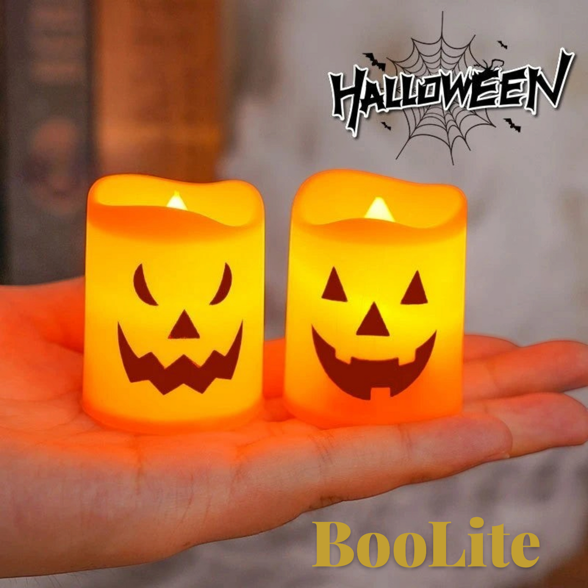 Gr8est BooLite battery-powered LED pumpkin candles with spooky jack-o'-lantern faces glowing in a hand