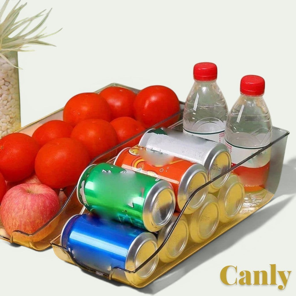 Gr8est Canly clear plastic fridge and pantry organizer basket filled with soda cans, water bottles, and fresh produce.