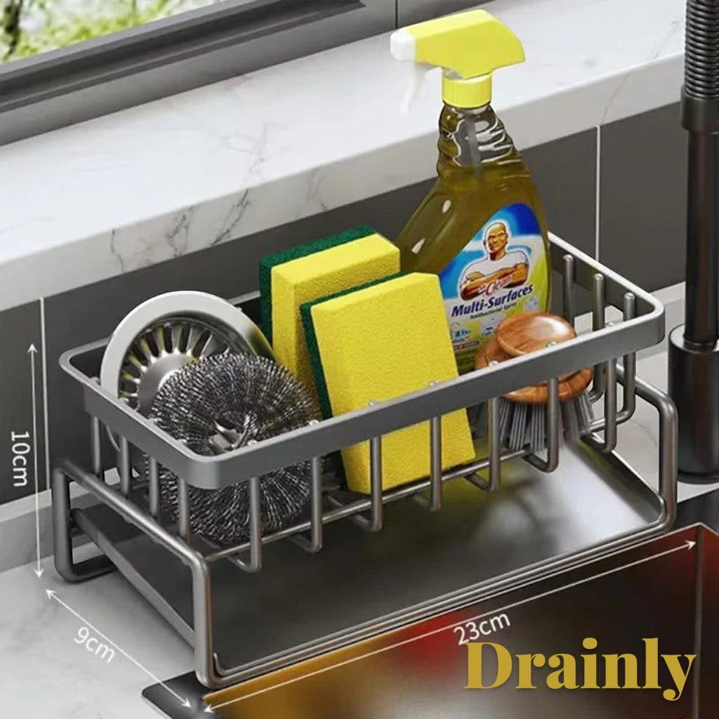 Gr8est carbon steel sink organizer with tilted drainage tray holding sponges, brushes, and soap on a countertop.