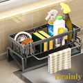 Gr8est carbon steel sink organizer with a tilted drainage tray holding sponges, brushes, and cleaning bottles.