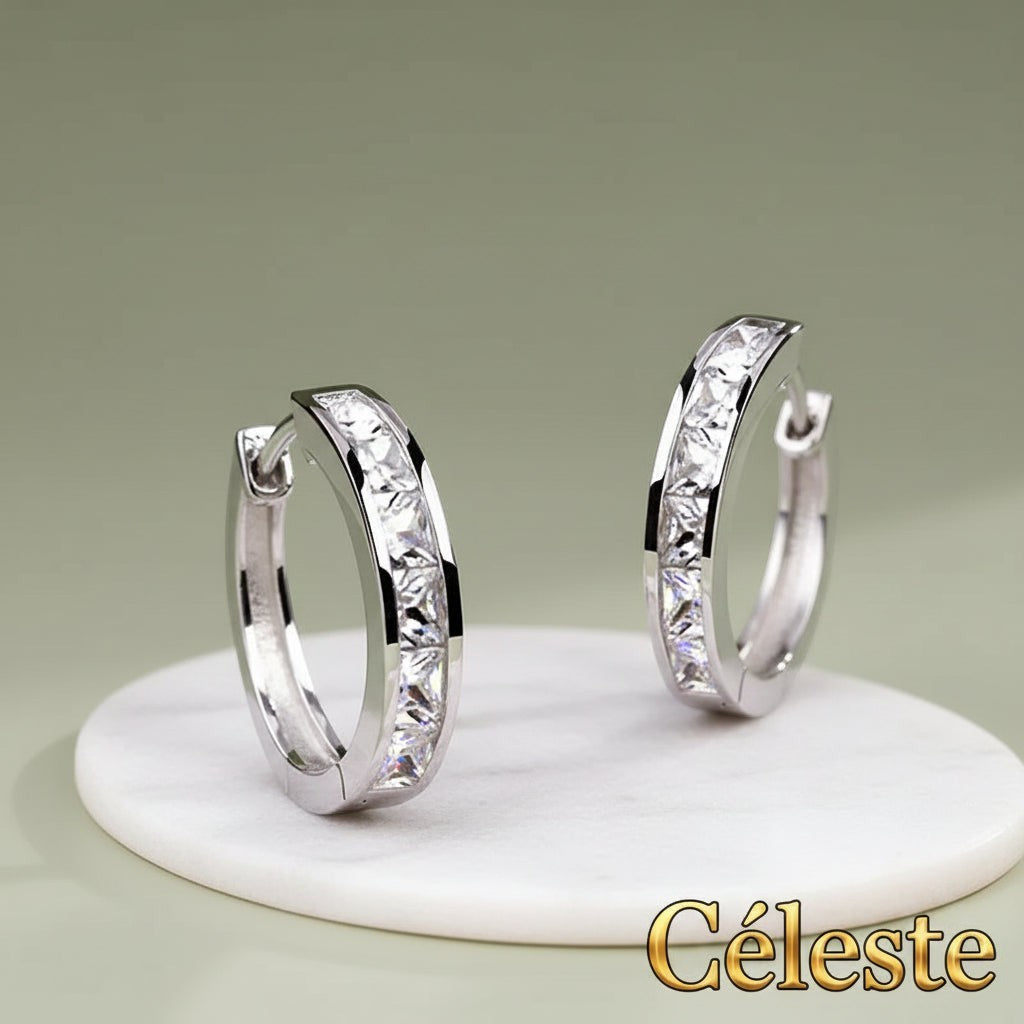 Gr8est Céleste hoop earrings featuring princess-cut cubic zirconia stones in a sleek silver-tone geometric design.