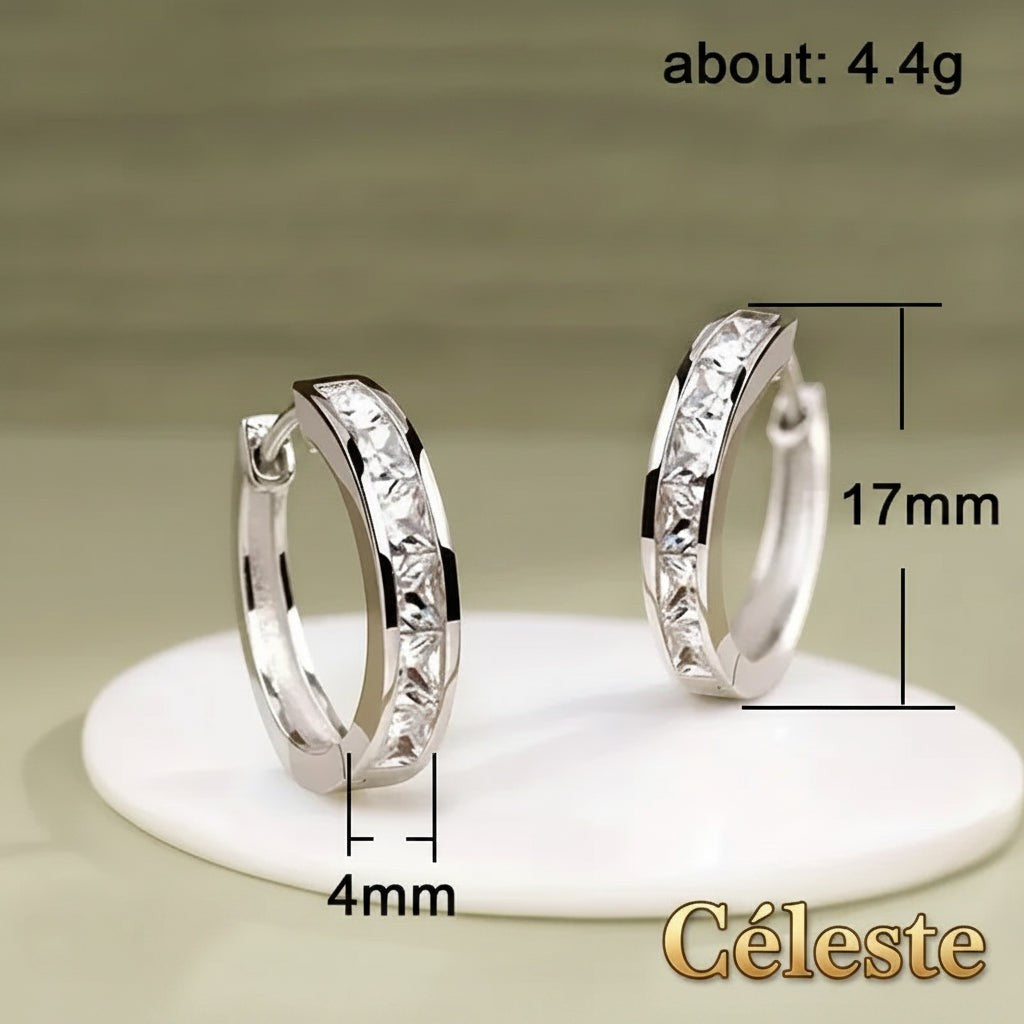 Gr8est Céleste hoop earrings featuring princess-cut cubic zirconia stones in a silver-tone zinc alloy geometric design.