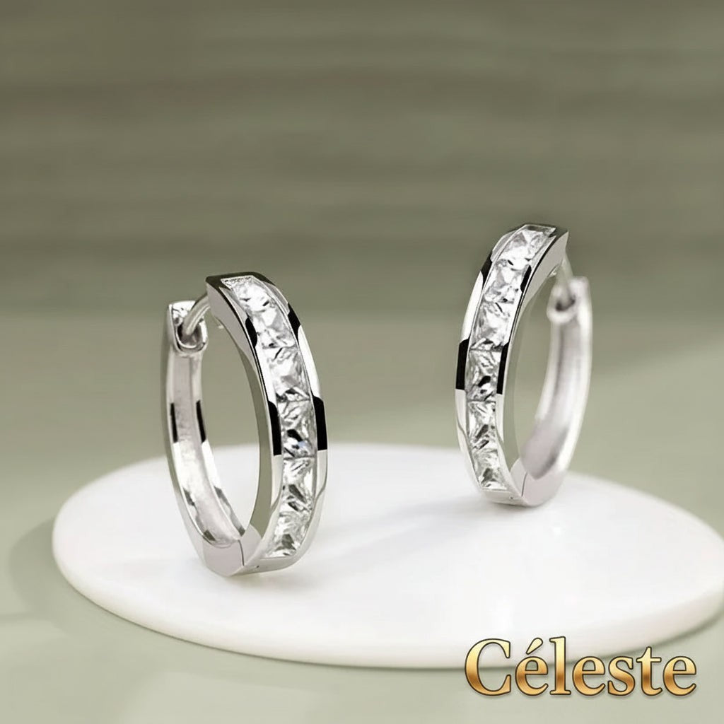 Gr8est Céleste hoop earrings featuring princess-cut cubic zirconia stones in a sleek silver-tone geometric setting.