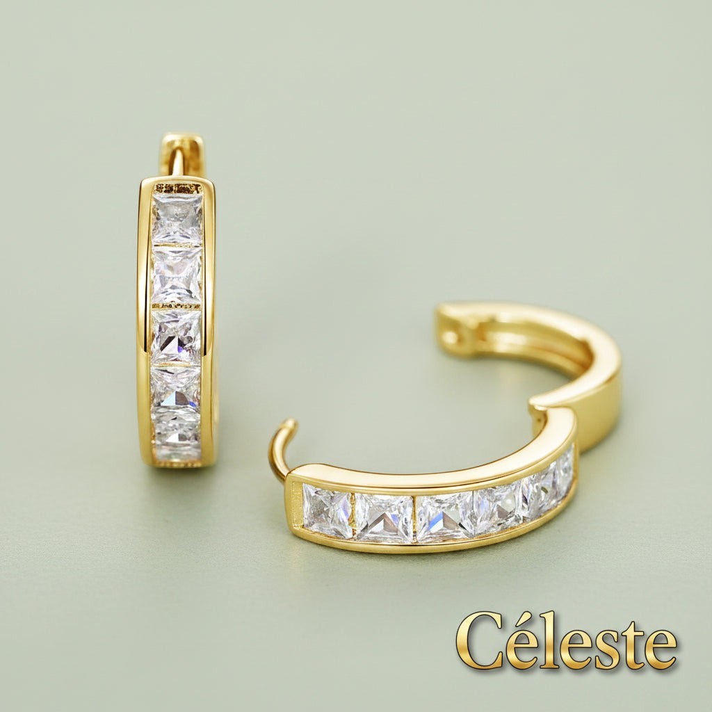 Gr8est Céleste gold-tone hoop earrings featuring princess-cut cubic zirconia stones in a sleek geometric design.
