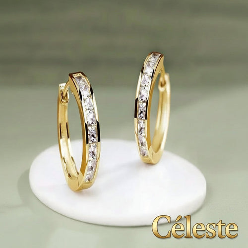 Gr8est Céleste gold-tone hoop earrings featuring princess-cut cubic zirconia stones in a sleek geometric design.