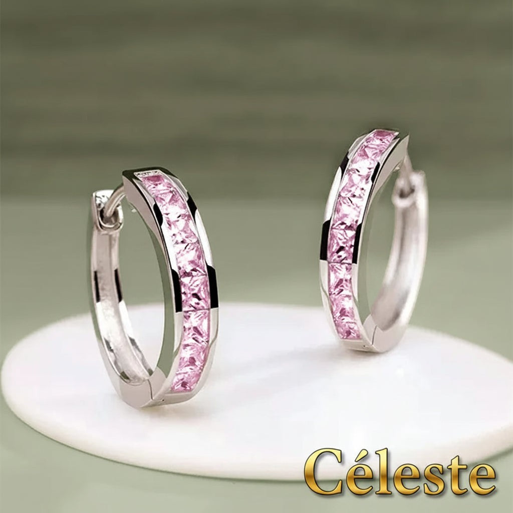 Gr8est Céleste hoop earrings featuring pink princess-cut cubic zirconia stones set in a silver-tone geometric hoop.