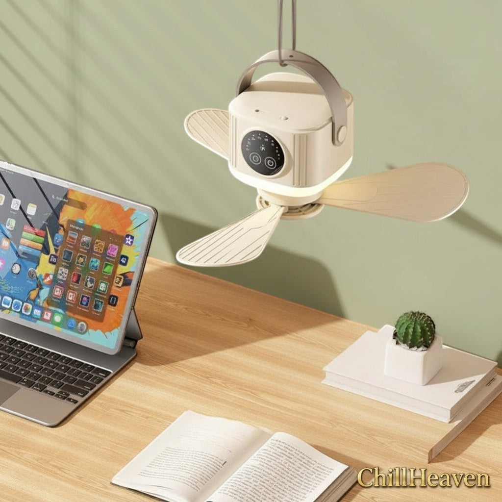 Gr8est ChillHeaven portable rechargeable ceiling fan with LED light and hanging strap, shown above a wooden desk.