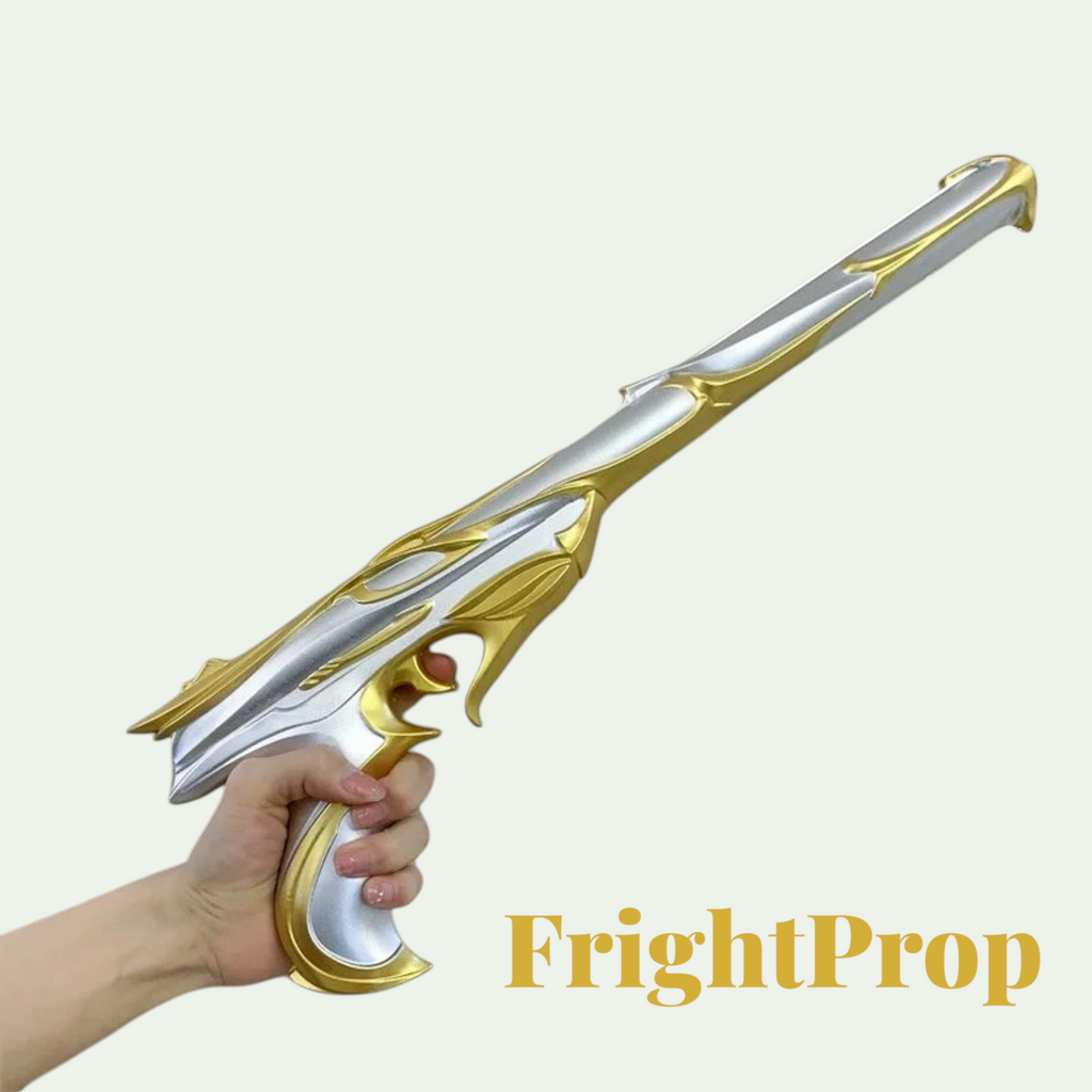 Gr8est PU rubber cosplay prop gun in silver and gold, held in a hand for a Halloween costume accessory.