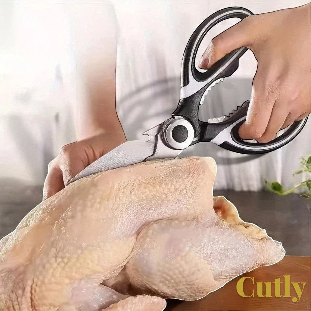 Gr8est Cutly heavy-duty stainless steel kitchen shears cutting raw poultry with ergonomic black and white handles