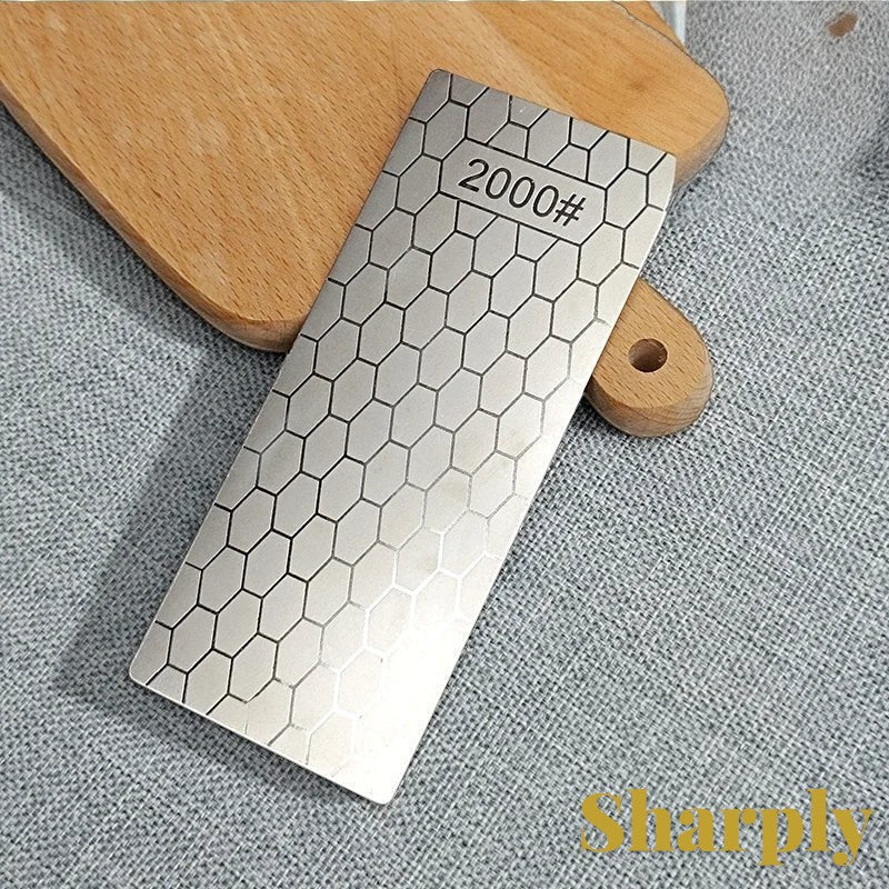 Gr8est diamond knife sharpening stone with a 2000 grit hexagonal pattern surface on a wooden cutting board.