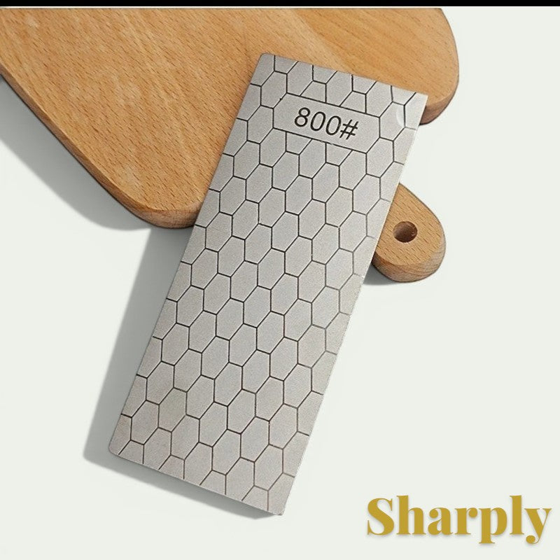 Gr8est diamond knife sharpening stone with an 800 grit hexagonal pattern surface on a wooden cutting board