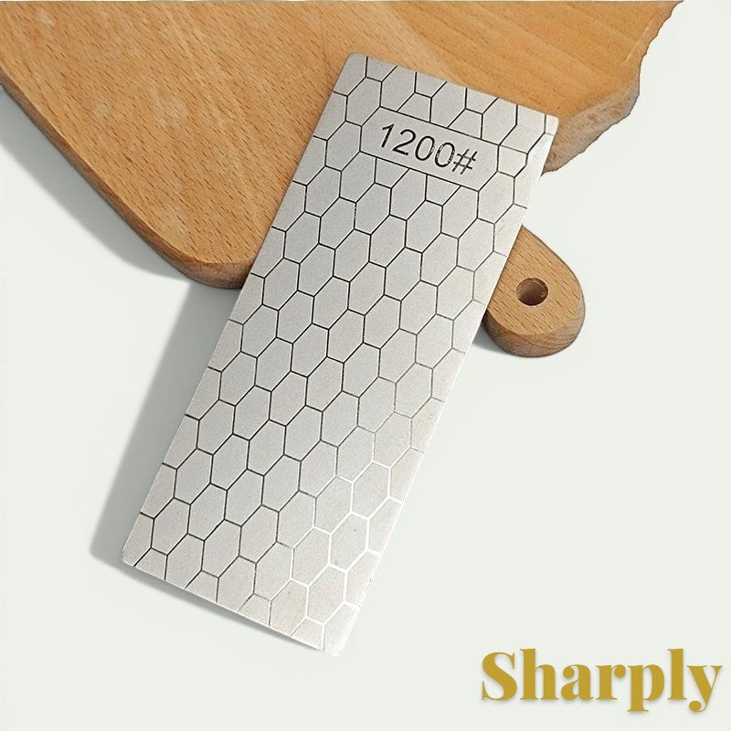 Gr8est diamond knife sharpening stone with a 1200 grit hexagonal pattern surface on a wooden cutting board