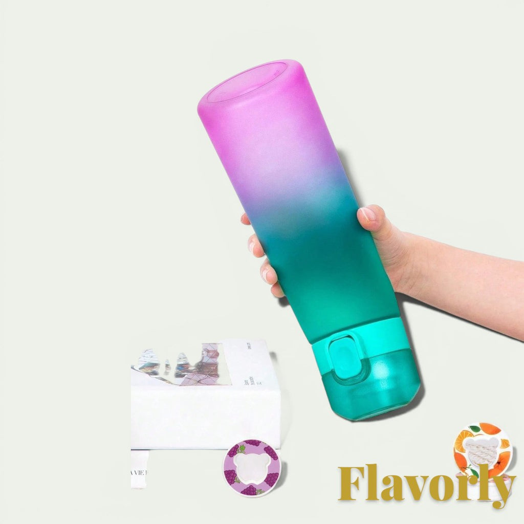 Gr8est Flavorly 650ml frosted gradient purple and teal scent pod water bottle held in a hand