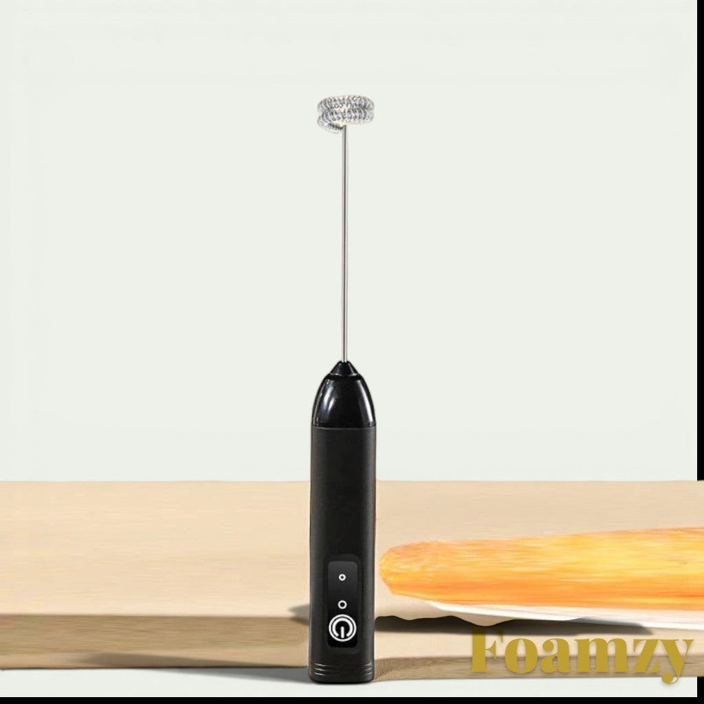 Gr8est Foamzy handheld electric milk frother and egg beater in black with a stainless steel whisk attachment