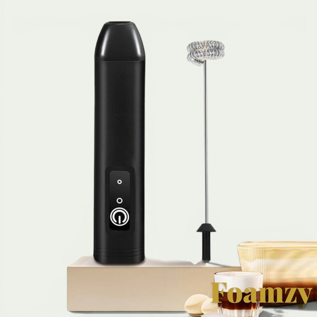 Gr8est Foamzy handheld electric milk frother and egg beater in black with a stainless steel whisk attachment.