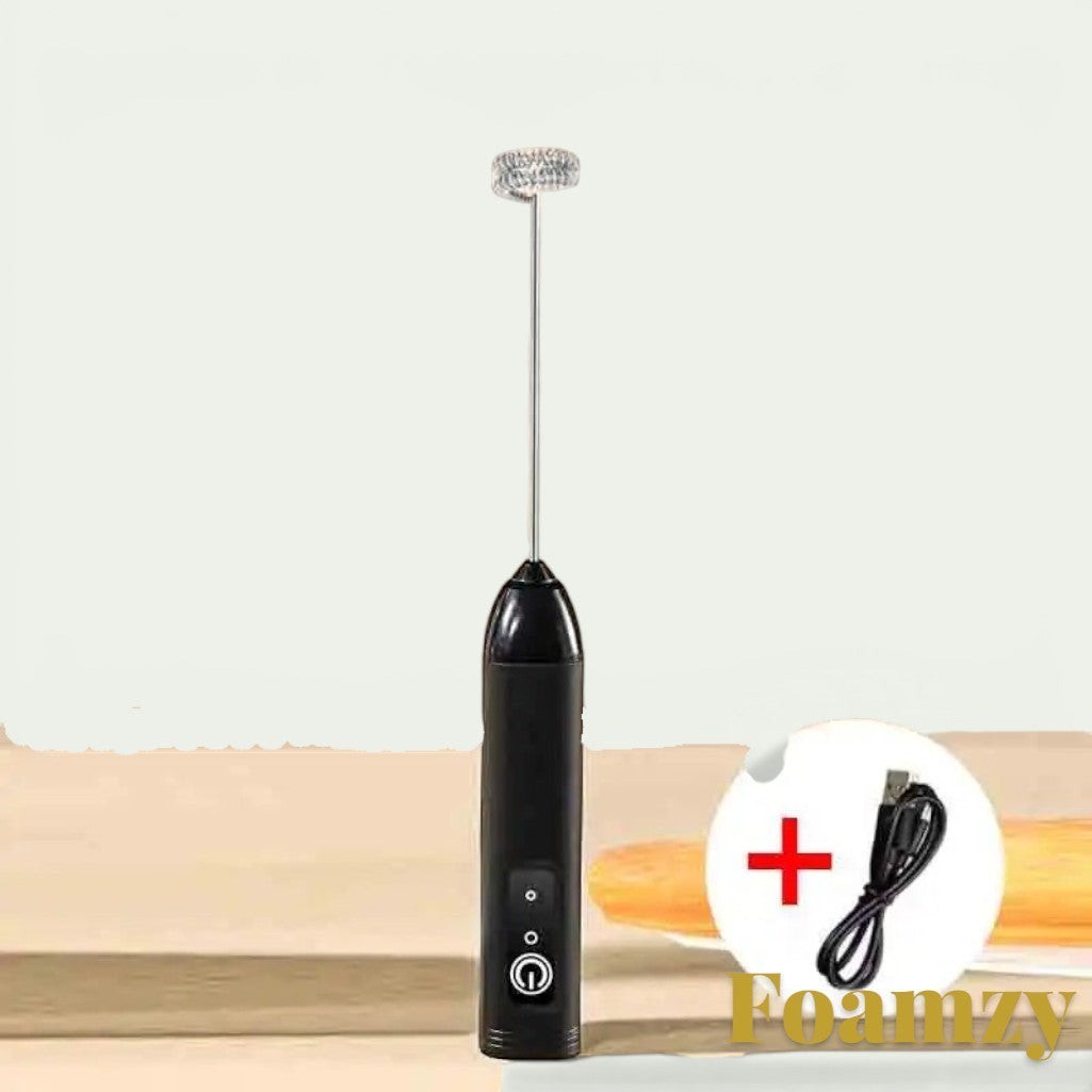 Gr8est Foamzy handheld electric milk frother and egg beater in black with a stainless steel whisk and USB cable.