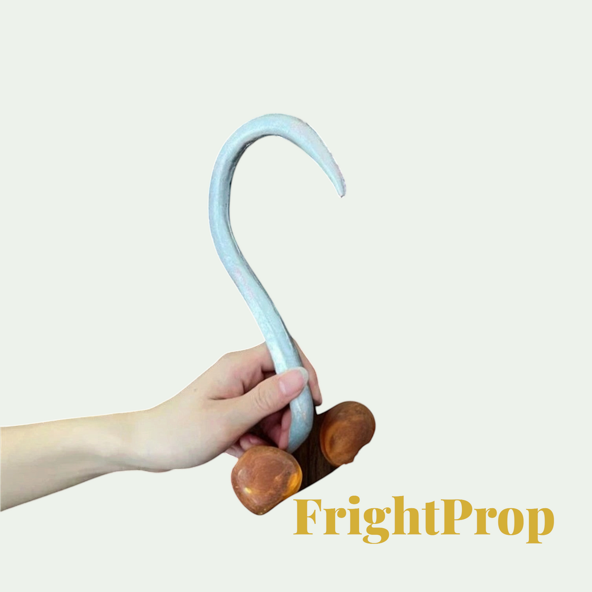 Gr8est FrightProp hook-shaped costume accessory made of soft PU material held in a hand for Halloween cosplay.