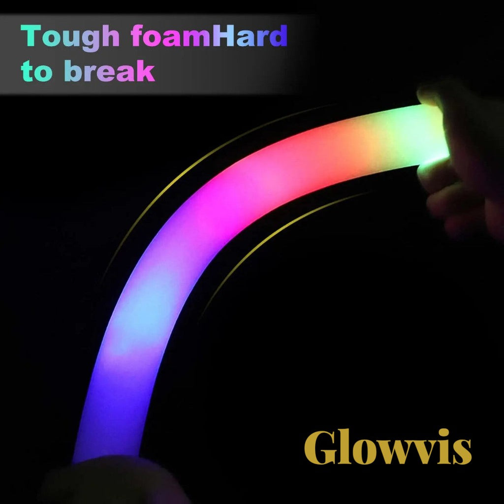 Gr8est Glowvis flexible LED foam glow stick glowing with vibrant RGB light in a dark setting