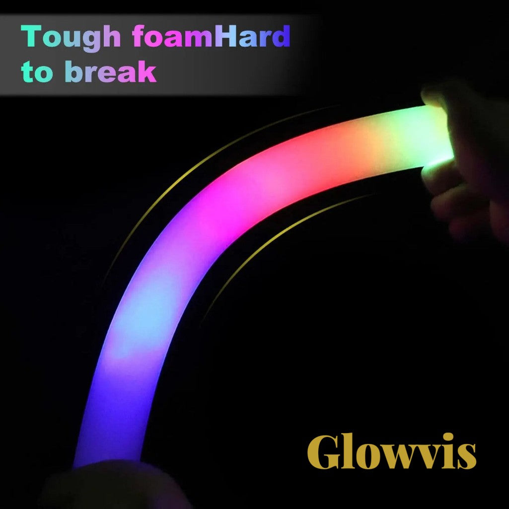 Gr8est Glowvis flexible LED foam glow stick glowing with vibrant RGB light in a dark setting