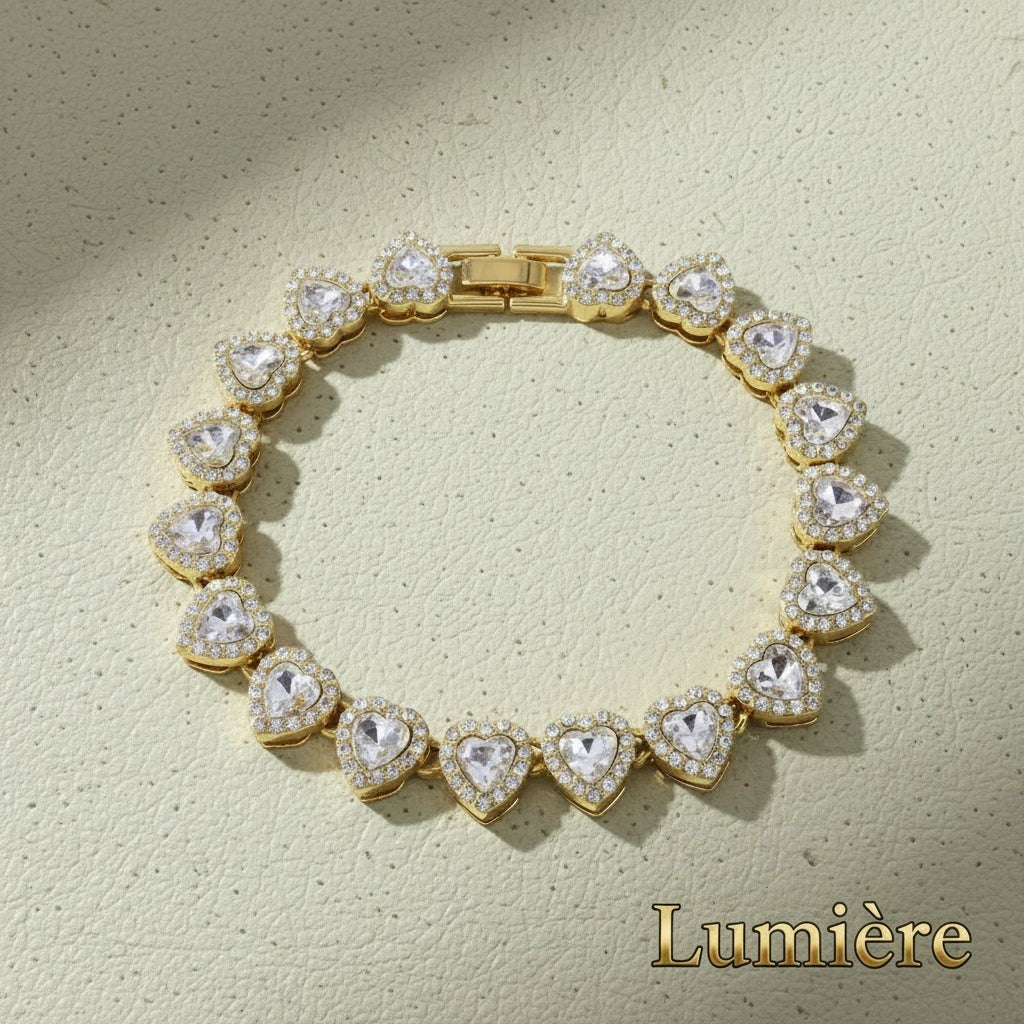 Gr8est gold-tone tennis bracelet featuring a row of heart-shaped rhinestones in a zinc alloy setting