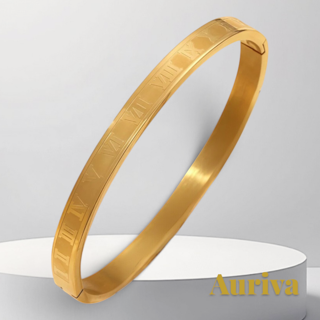 Gr8est gold stainless steel bangle bracelet featuring engraved Roman numerals on a minimalist circular display stand