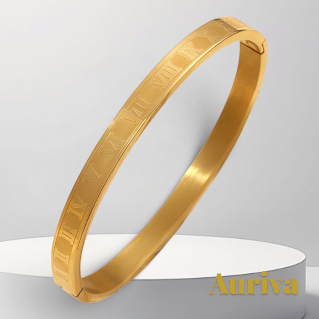 Gr8est gold stainless steel bangle bracelet featuring engraved Roman numerals on a minimalist circular display stand