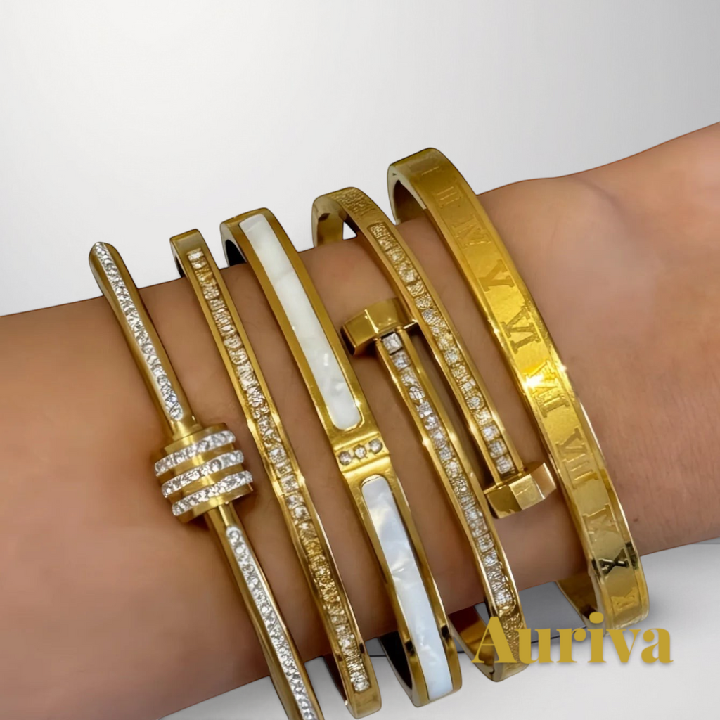 Gr8est set of five gold-tone stainless steel stackable bangles featuring zircon accents and Roman numeral engravings