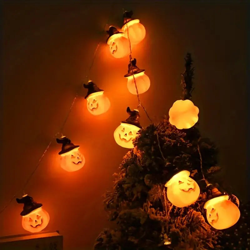 Gr8est battery-powered Halloween string lights featuring warm white glowing pumpkins wearing black witch hats on a tree