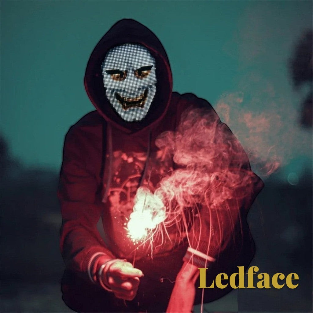 Gr8est Ledface Bluetooth RGB LED mask worn by a person in a hoodie holding a sparkler for a rave or cosplay event