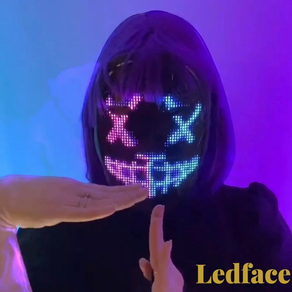 Gr8est Ledface programmable RGB LED mask showing a glowing digital face pattern on a person with purple hair
