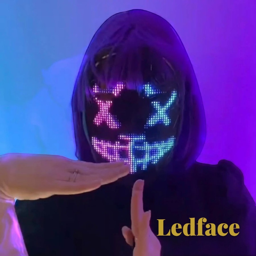 Gr8est Ledface programmable RGB LED mask showing a glowing digital face pattern on a person with purple hair