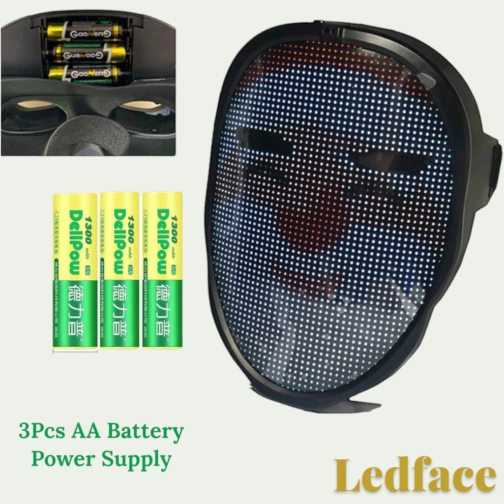 Gr8est Ledface Bluetooth RGB LED mask showing a digital face display with three AA batteries for power