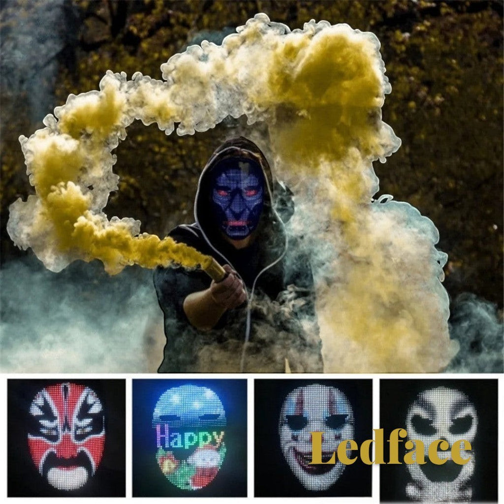 Gr8est Ledface programmable RGB LED mask worn by a person in a hoodie surrounded by yellow smoke for cosplay events.