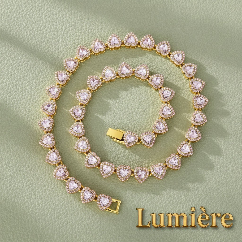 Gr8est Lumière heart tennis chain set featuring pink rhinestone hearts in a gold-tone zinc alloy metal finish.