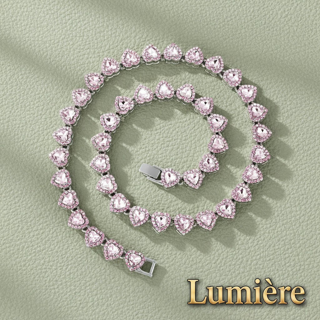Gr8est Lumière heart tennis chain necklace with shimmering pink rhinestones and silver-tone metal links.