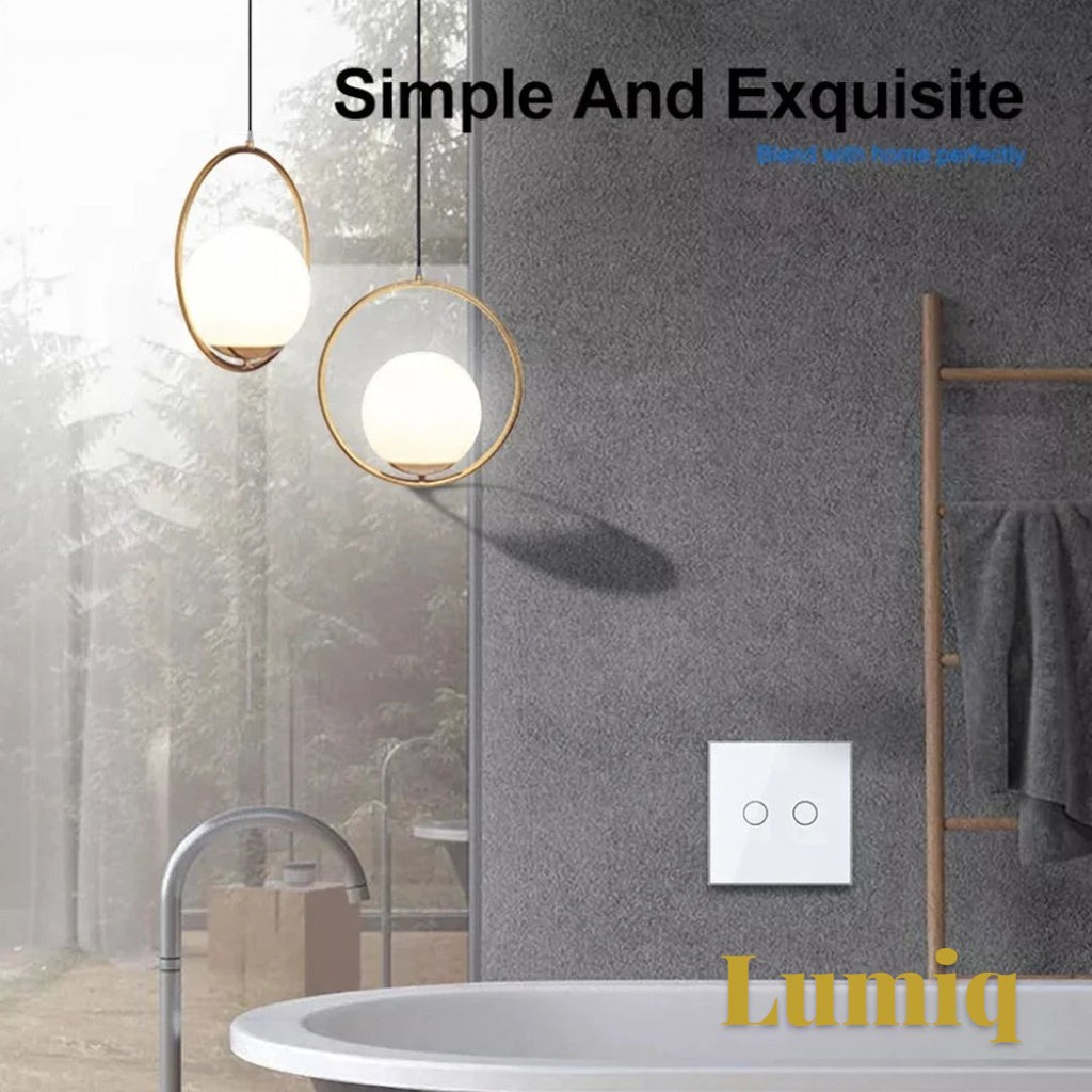 Gr8est Lumiq white 2-gang smart touch switch with tempered glass panel installed on a grey wall in a modern bathroom.