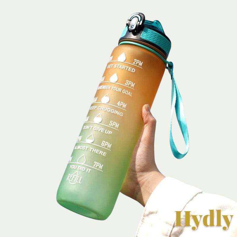 Gr8est 1L motivational water bottle in orange and green gradient with time markers, straw, and carrying strap.