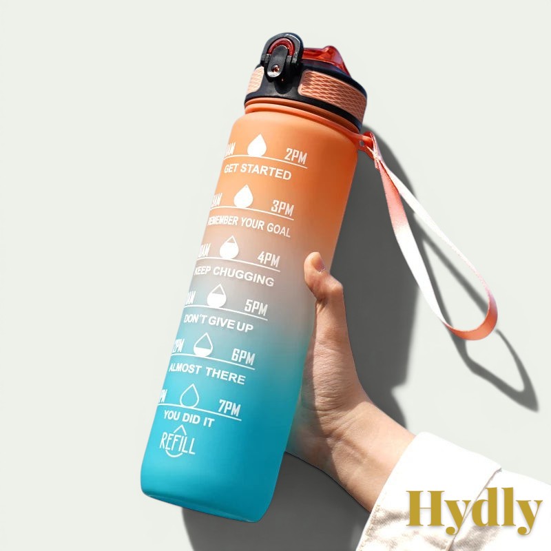 Gr8est 1L motivational water bottle in orange and blue gradient with time markers, straw, and carrying strap.