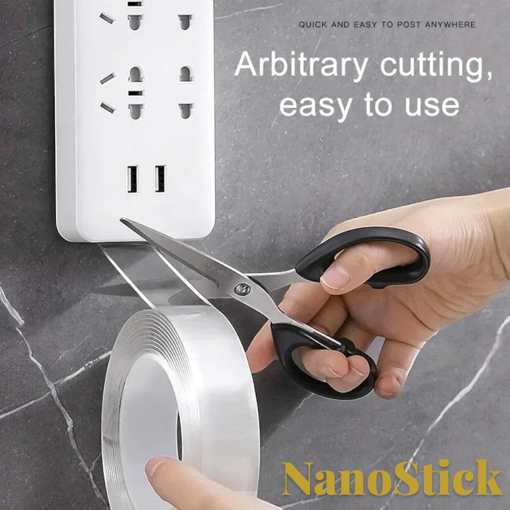 Gr8est heavy-duty clear nano double-sided tape being cut with scissors to mount a power strip on a tiled wall