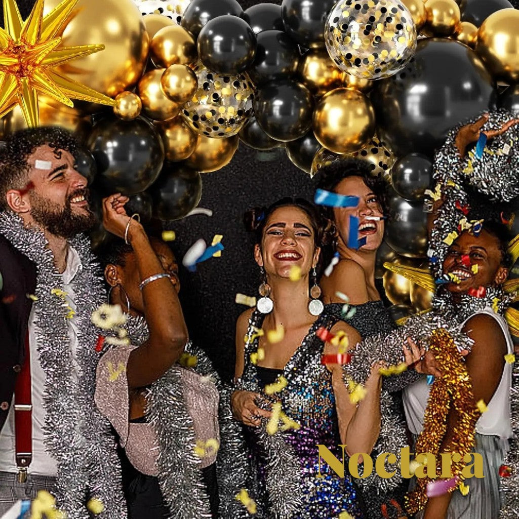 Gr8est Noctara black and gold balloon garland arch with confetti balloons at a festive party with happy people