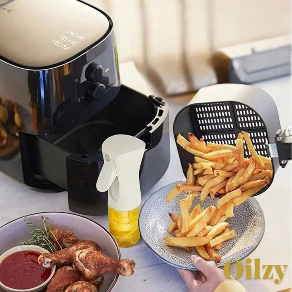 Gr8est oil spray bottle with white nozzle and clear base, used for healthy cooking with an air fryer and fries.